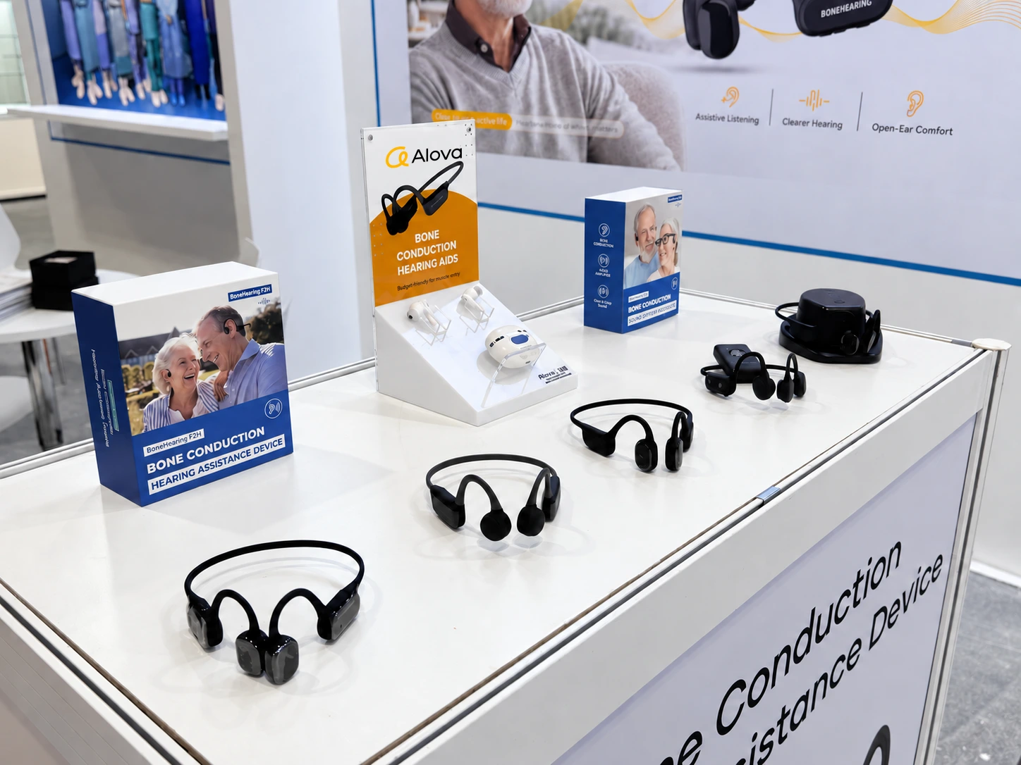 Alova bone conduction hearing assistance devices and packaging on an exhibition counter