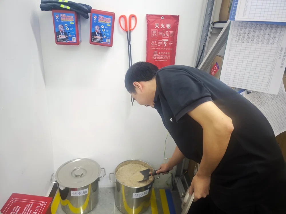 Alova employee learning about fire-safety equipment on site
